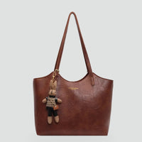 Women's Handbag with Detachable Charm and Elegant Trim Details