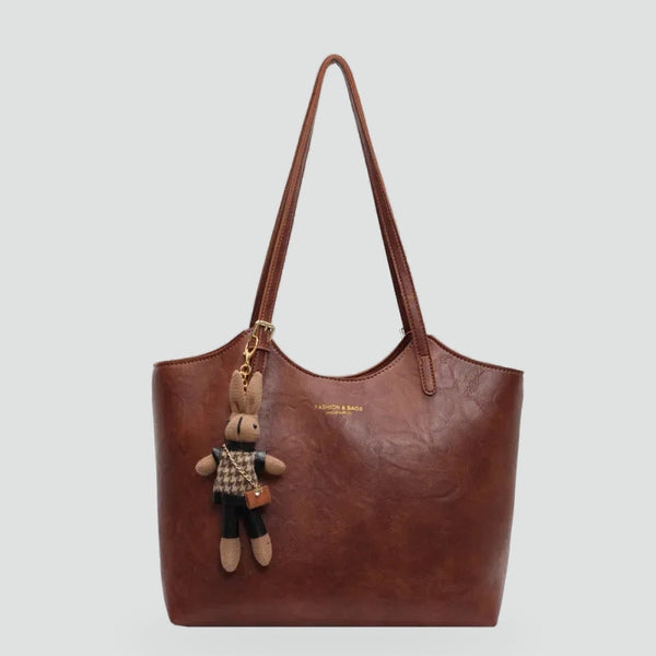 Women's Handbag with Detachable Charm and Elegant Trim Details